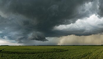 Stormy clouds over field